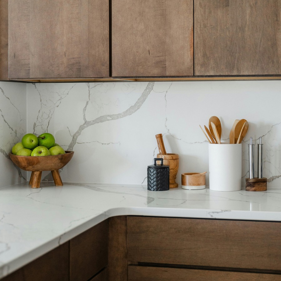 kitchen with ample counter-space, modern appliances and bright lighting