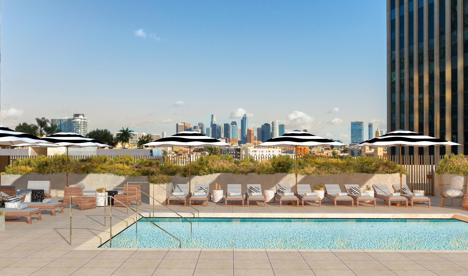 a pool with lounge chairs around it